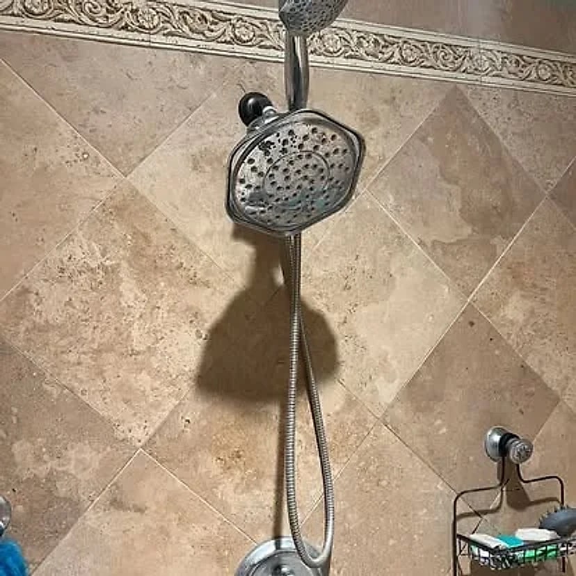 The same tiled shower fitted with a dual showerhead setup